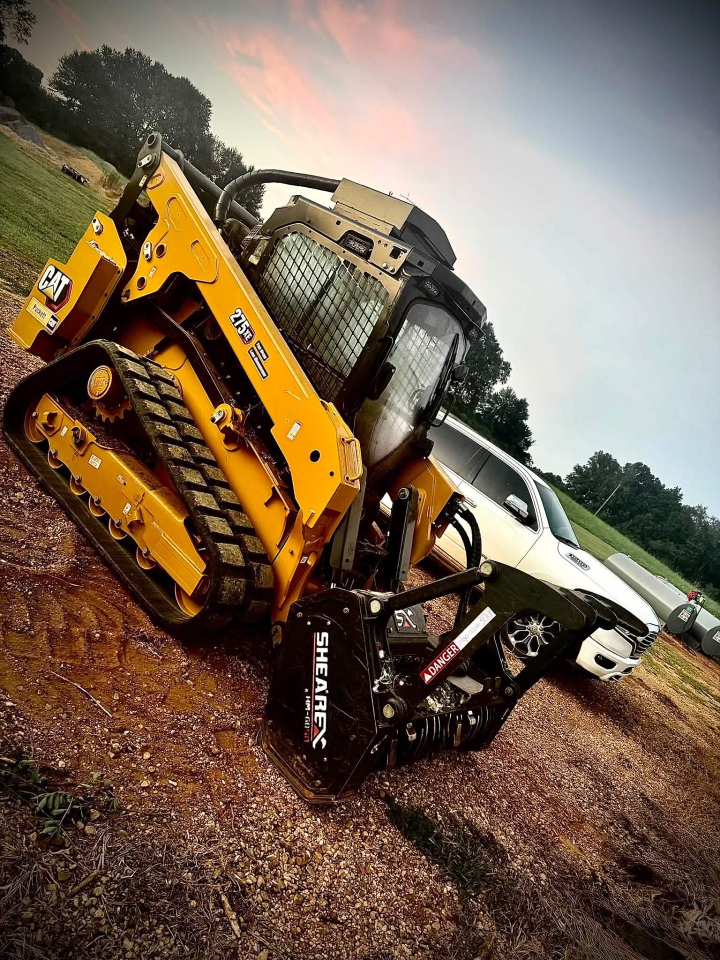 Forestry mulcher attachment grinding underbrush in a Mississippi pine forest